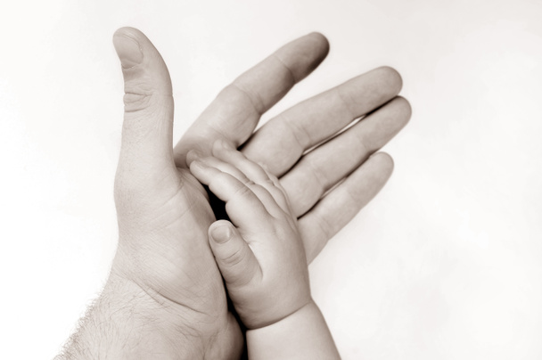 Чоловіча та дитяча рука
 - Фото, зображення