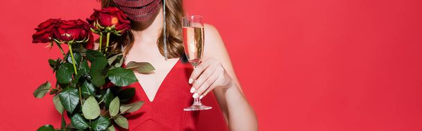 cropped view of young woman in protective mask with rhinestones holding roses on red, banner - Photo, Image