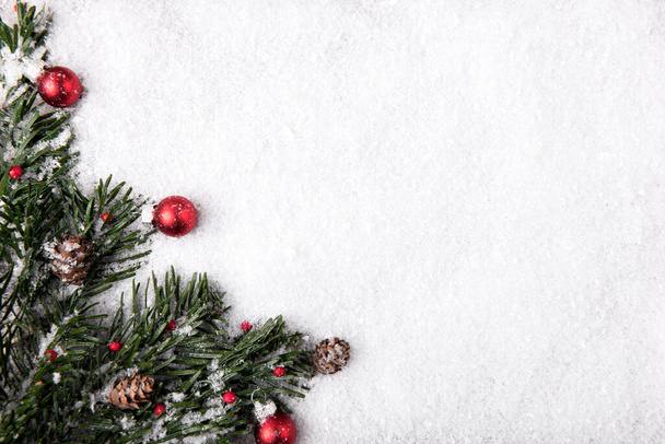 Festive Christmas decorations on snowy background - Photo, image