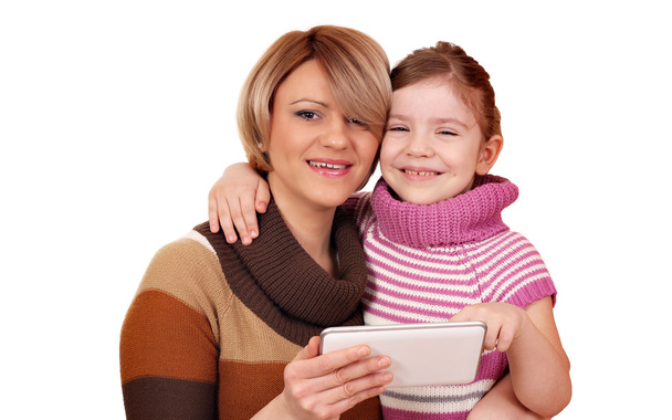 happy mother and daughter with tablet pc - Zdjęcie, obraz