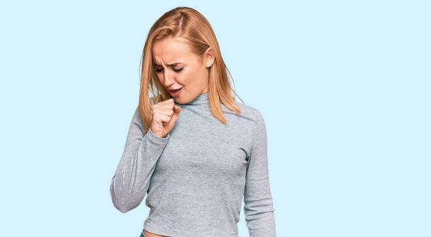 Beautiful caucasian woman wearing casual clothes feeling unwell and coughing as symptom for cold or bronchitis. health care concept.  - Photo, Image