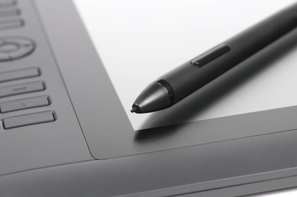 Stylus for digital tablet isolated on screen background. High resolution photo. Full depth of field. - Foto, immagini