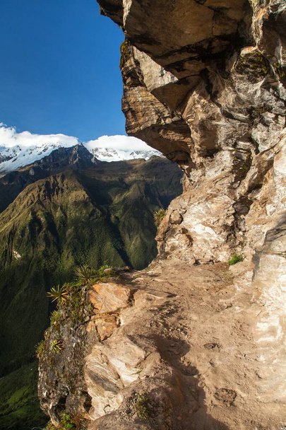 pathway and rock face, Mount Saksarayuq, Andes mountains, Choquequirao trekking trail near Machu Picchu, Inca trail, Cuzco or Cusco region in Peru  - Φωτογραφία, εικόνα