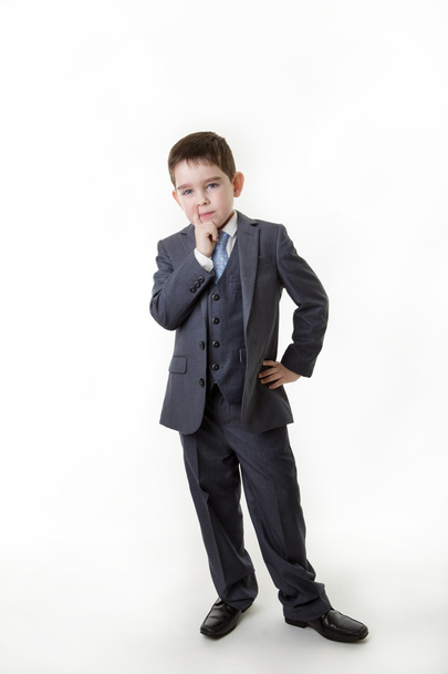 nuori lapsi pukeutunut liikemieheksi
 - Valokuva, kuva