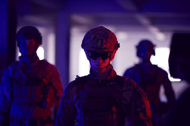 soldier squad team walking in urban environment colored lightis - Zdjęcie, obraz