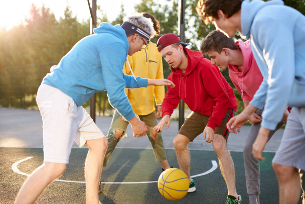 basketball players outdoors. summer vacation, holidays, games and friendship concept - Φωτογραφία, εικόνα