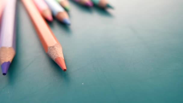 Close up of colorful pencils on color background  - Footage, Video