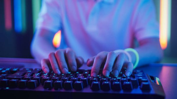 Close-up on the Hands of the Gamer Playing in the Video Game Using Keyboard. Hacker Breaks into System. - Fotó, kép