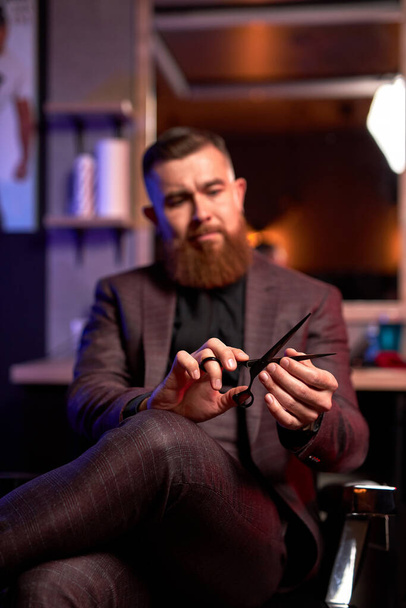 close-up photo of shears in hands of professional male barber - Photo, Image