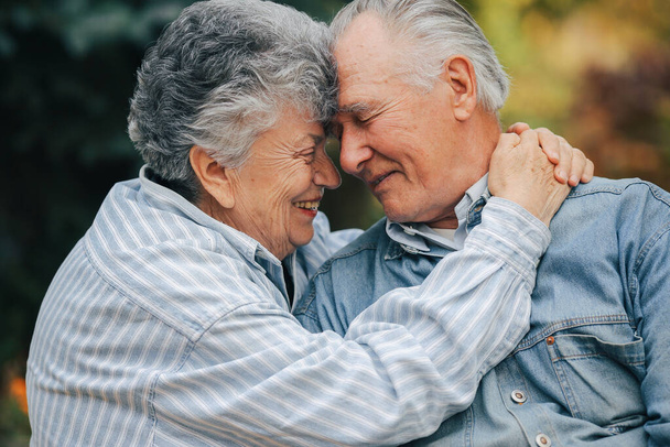 Beautiful old couple spent time together in a park - Photo, image