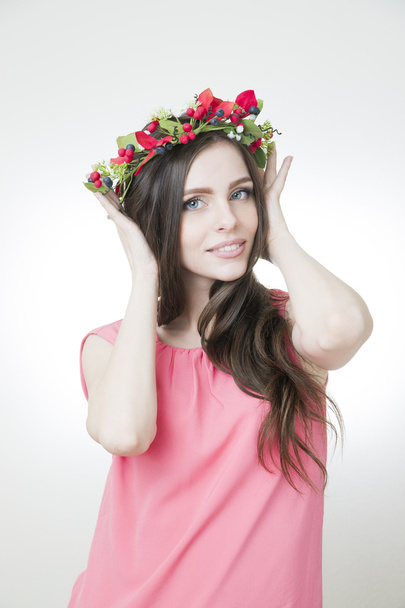 Young beautiful woman with flower wreath on head - Fotoğraf, Görsel