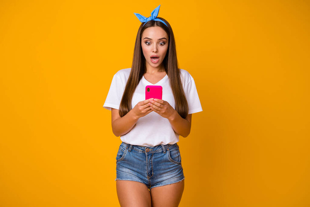 Portrait of astonished speechless girl use smartphone impressed by social network information scream wow omg wear good look outfit isolated over bright shine color background - Fotoğraf, Görsel