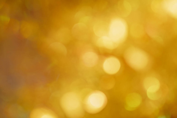 abstract bokeh background. christmas bokeh. Yellow blurred background. golden glow - Fotografie, Obrázek