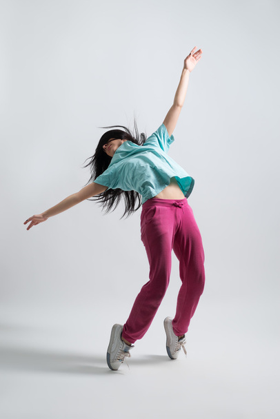 athletic girl standing on his haunches - Fotó, kép