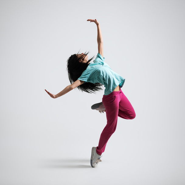 athletic girl standing on his haunches - Fotó, kép