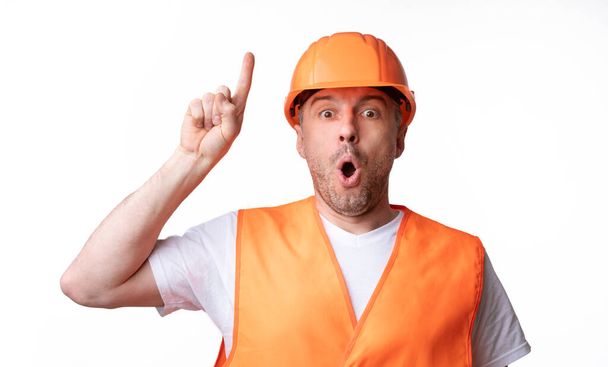 Builder Worker ujjal felfelé, amelynek ötlete a fehér háttér - Fotó, kép