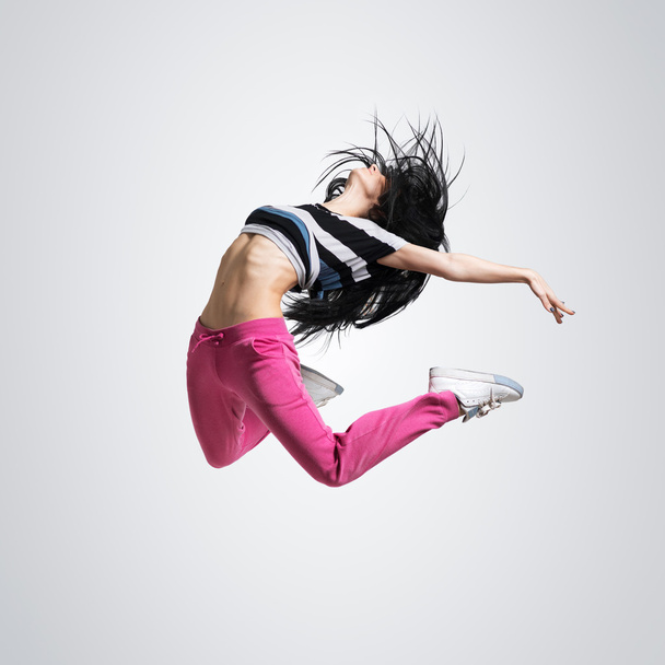 athletic girl dancing jumping - 写真・画像