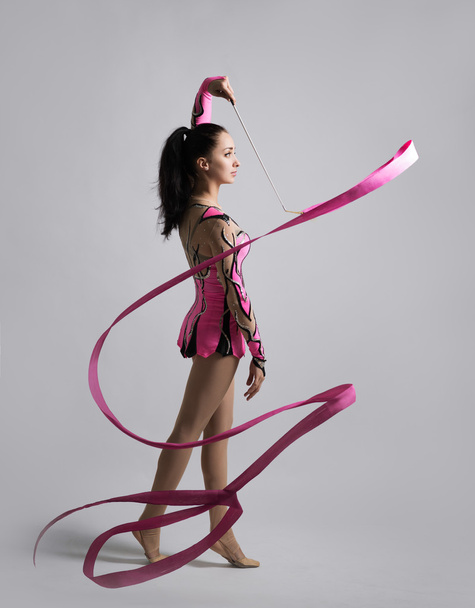 beautiful Caucasian girl gymnast with a ribbon - Fotoğraf, Görsel