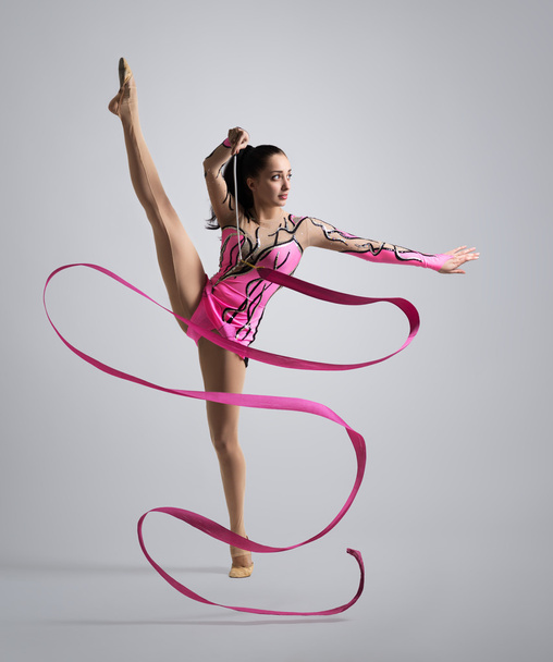 beautiful Caucasian girl gymnast with a ribbon - Photo, Image