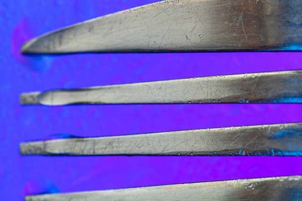 Abstract fork detail on colorful surface. Abstract background concept - Foto, afbeelding