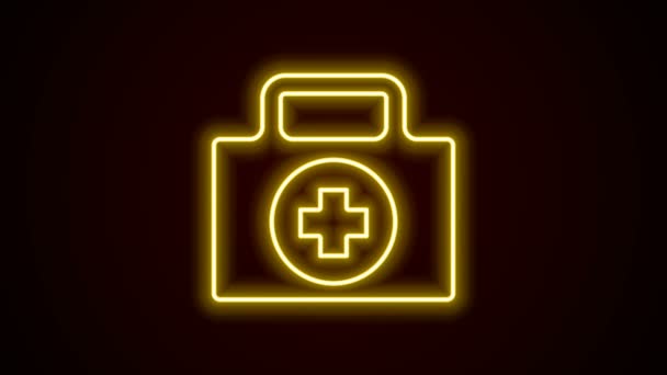 Zářící neonová čára Ikona lékárničky izolovaná na černém pozadí. Krabice s křížem. Lékařské vybavení pro případ nouze. Zdravotní koncepce. Grafická animace pohybu videa 4K - Záběry, video