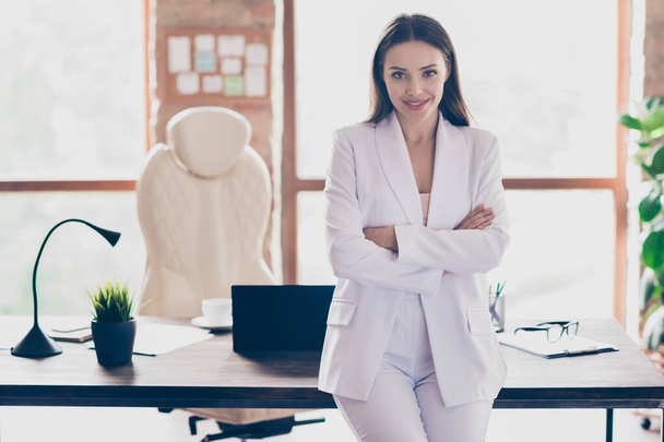 Photo of attractive beautiful business lady hold arms crossed self-confident person friendly smile home spacious office social distance formal wear blazer pants white suit indoors - Fotó, kép