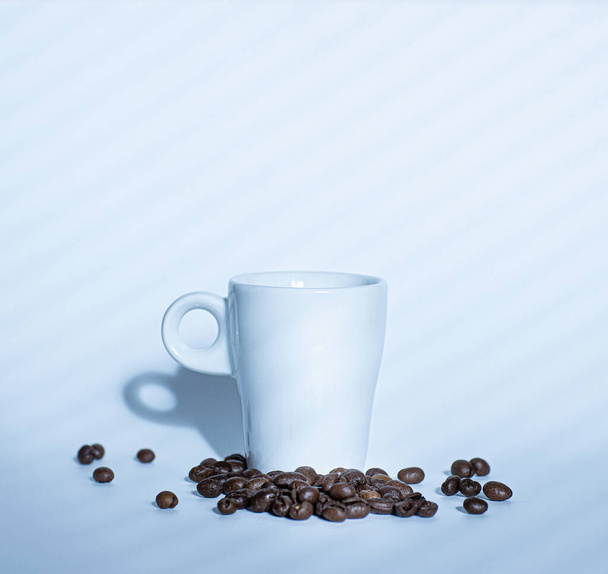 clean luxurycoffee cup on white background witn beans - 写真・画像