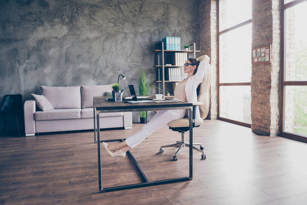 Profile side view of chic classy luxury dreamy cheery lady specialist partner freelancer resting sitting in chair corporate law modern industrial loft brick interior workplace workstation open space - Фото, зображення