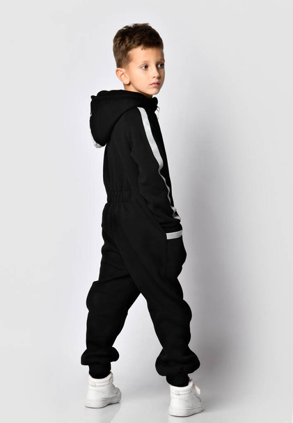 Fashion boy posing in sport tracksuit and snickers - Фото, изображение