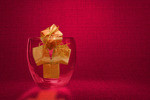 Colorful Christmas ornament in the glass bowl on a textured background - Foto, immagini