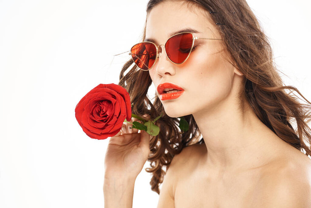 Woman with naked shoulders and red rose evening makeup light background - Φωτογραφία, εικόνα