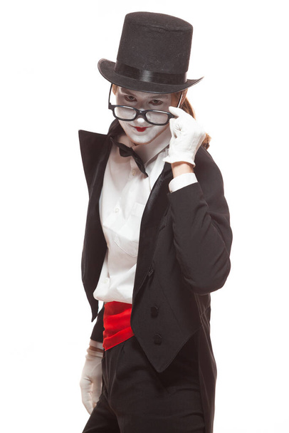 Portrait of male mime artist performing, isolated on white background. Mime lowered his glasses to look directly into eyes - Φωτογραφία, εικόνα