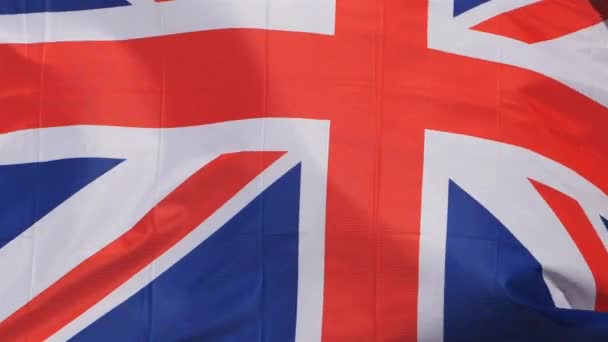 Az Egyesült Királyság nemzeti zászlója lobogott a szélben. - Felvétel, videó