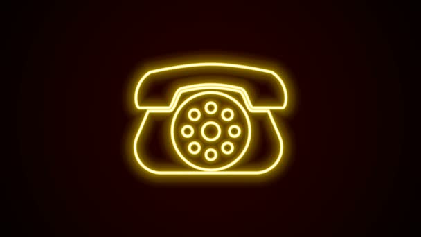 Leuchtende Leuchtschrift Telefon-Symbol isoliert auf schwarzem Hintergrund. Festnetztelefon. 4K Video Motion Grafik Animation - Filmmaterial, Video