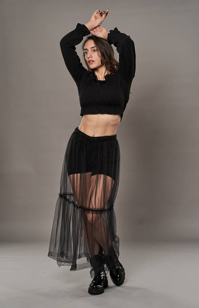 Gorgeous glamour model girl dressed in black on gray background - Zdjęcie, obraz
