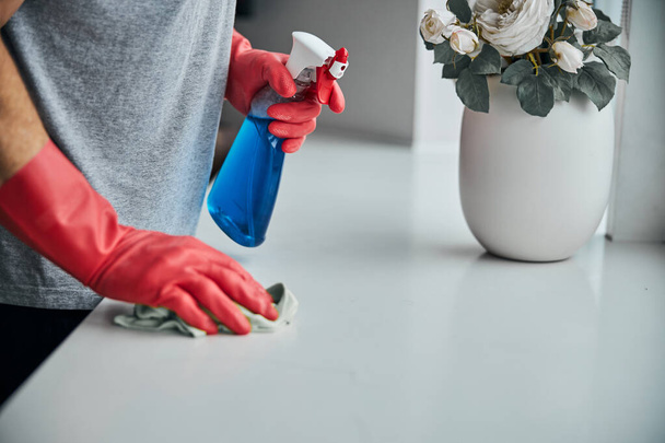 Fragment photo of man dusting his windowsill with wet wipe - Foto, Imagem