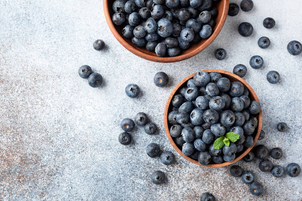 Blueberries in bowl top view - Фото, зображення