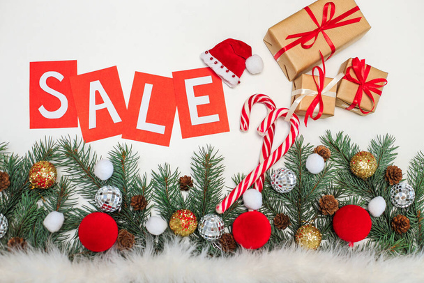 Special offer, new year's sale, discounts, beautiful discount banner with tree branches, Christmas decorations and gifts - 写真・画像