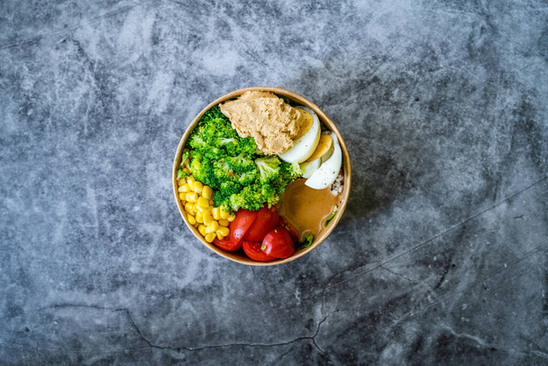 Healthy Organic Athlete Protein Food Bowl with Broccoli, Tricolor Quinoa, Peanut Butter Soy Sauce, Brown Rice, Egg and Hummus for Fitness Sport. Ready to Eat. - Фото, зображення