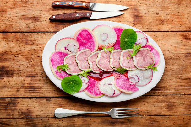 Appetizing dietary salad with veal tongue and radish - Photo, Image
