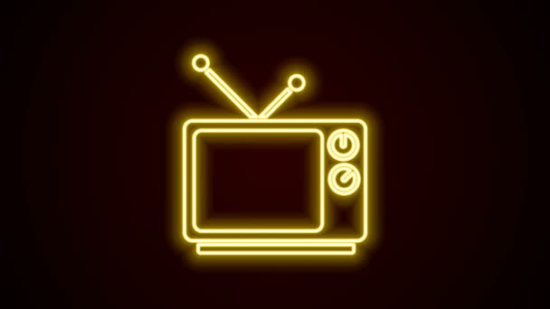Parlayan neon hattı Retro TV simgesi siyah arkaplanda izole edildi. Televizyon tabelası. 4K Video hareketli grafik canlandırması - Video, Çekim
