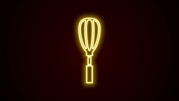 Ragyogó neon vonal Kitchen habverő ikon elszigetelt fekete alapon. Főzőeszköz, tojásverő. Evőeszköz jel. Ételkeverék szimbólum. 4K Videó mozgás grafikus animáció - Felvétel, videó