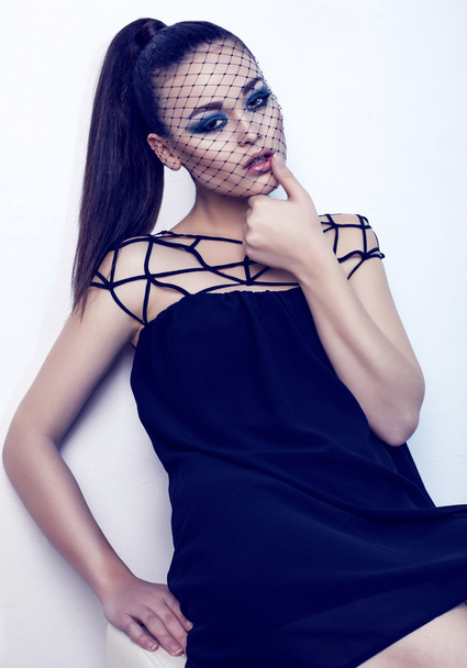 glamour model with dark hair with veil on the face - 写真・画像
