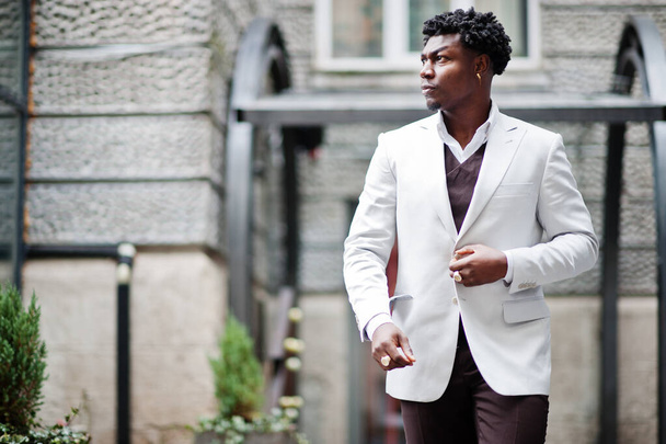 Thoughtful young handsome african american gentleman in formalwear. Black stylish model man in white jacket. - Foto, immagini