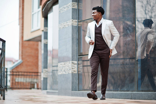 Thoughtful young handsome african american gentleman in formalwear. Black stylish model man in white jacket. - Фото, изображение