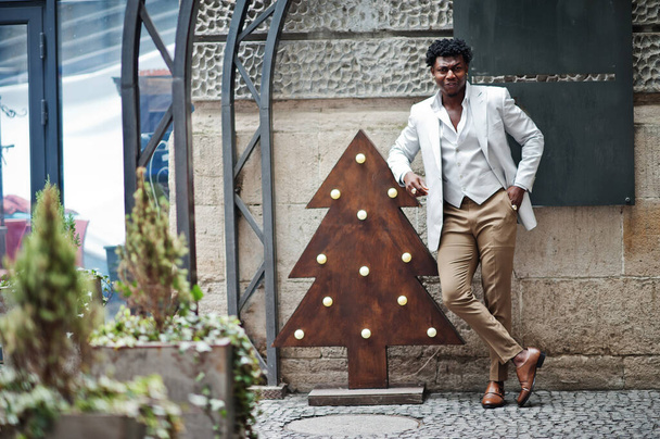 Thoughtful young handsome african american gentleman in formalwear. Black stylish model man in white jacket. - Фото, зображення