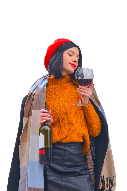 Portrait of a gorgeous young brunette woman having wine fun. Girl in autumn clothes with a glass of wine. Banner, drinking wine concept. Isolated on white. - Φωτογραφία, εικόνα