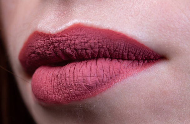 Image of females lips with red matte lipstick - Foto, Bild