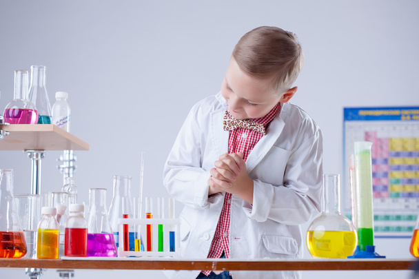 Image of little scientist posing with reagents - Photo, image