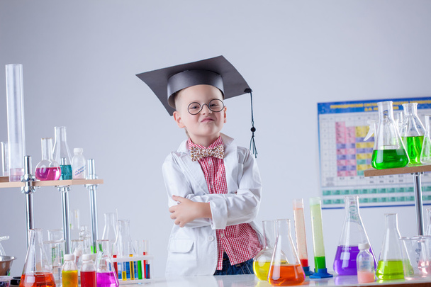 Funny boy posing as chemist in chemical laboratory - Φωτογραφία, εικόνα